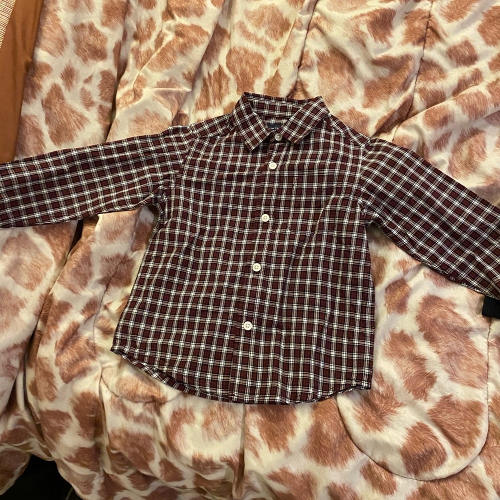 Children place button up boys shirt